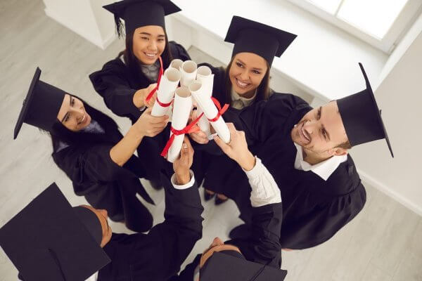 graduation class - women glad they learned 'how to postpone your period'.