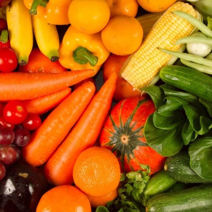 Spread of yellow, orange and green vegetables - Eating superfoods is one of the essential aspects of Biohacking
