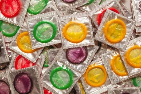 Colourful colllection of condoms in single packs - birth control methods