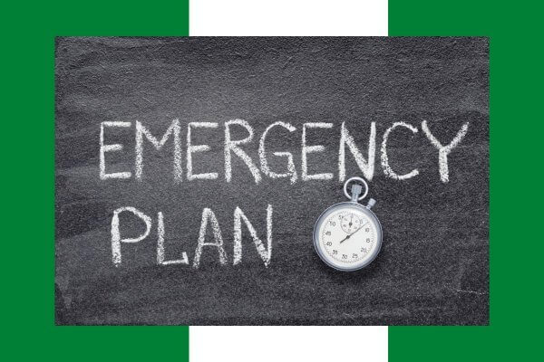 Blackboard inscribed with Emergency plan and a stopwatch in the frame on the background of the Nigerian flag indicating the importance of time with effective emergency contraception