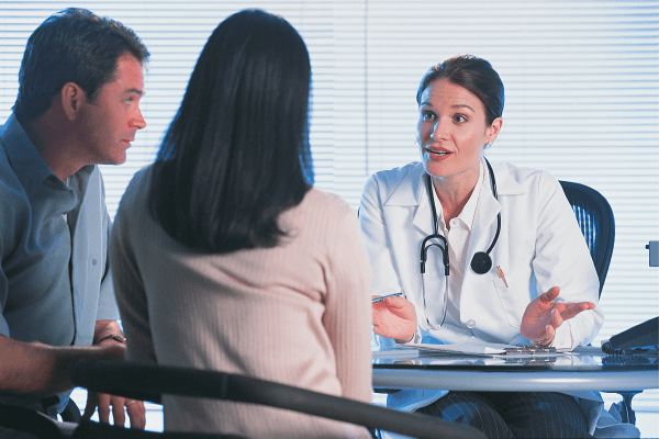 White couple seeking advice from specialist about egg donor ivf process 