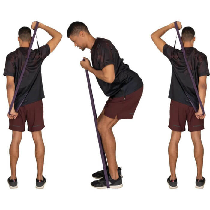 Man of african origin using bands in different positons for a cardio workout