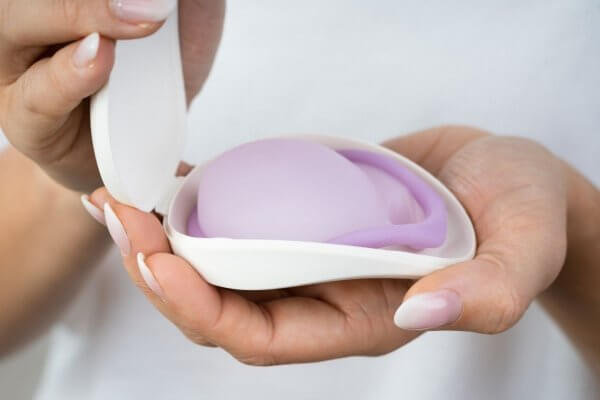 natural birth control methods - lady holding a diaphragm in its open case