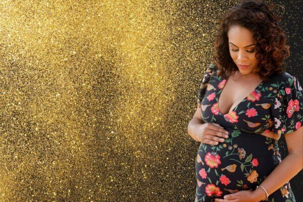Pregnant lady cradling her bump - me time At Christmas