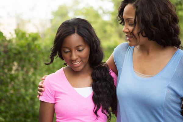 African mum and daughter - she knows talking about sex to your kids is an important responsibility