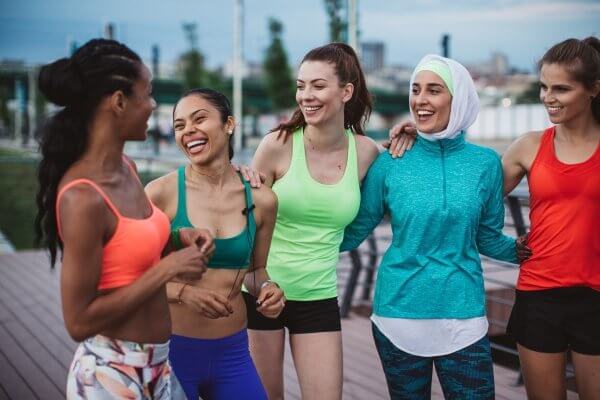 group of multi-ethnic women dressed in gym clothes