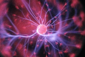 Image of a circular pink cell with threads spredaing out from it for Covid-19 experience