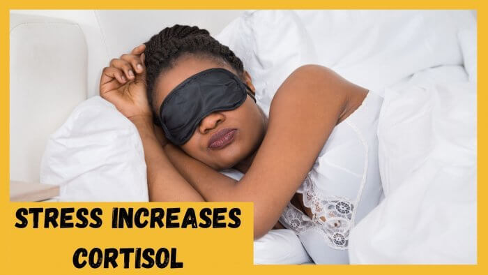 Sleeping lady in white nightie and black sleep mask - important to lose stubborn belly fat