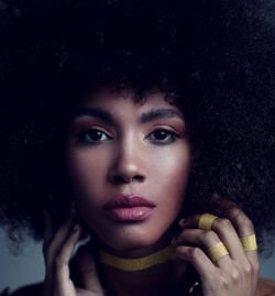 gorgeous young black woman with afro hair - women go through painful periods