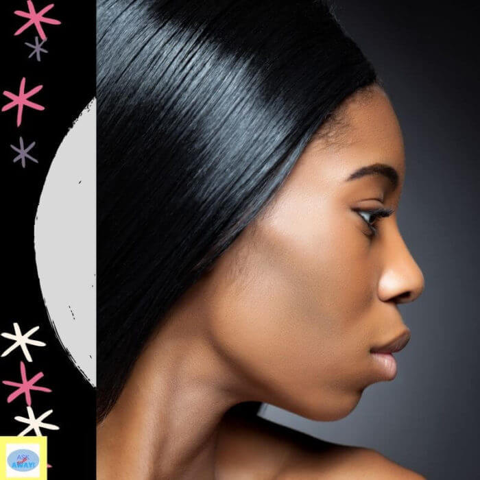 smooth skin side image of a young african lady with glowing skin and coal black shiny hair