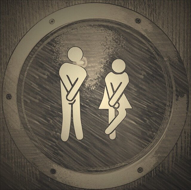 Man and Woman desperate for a toilet!